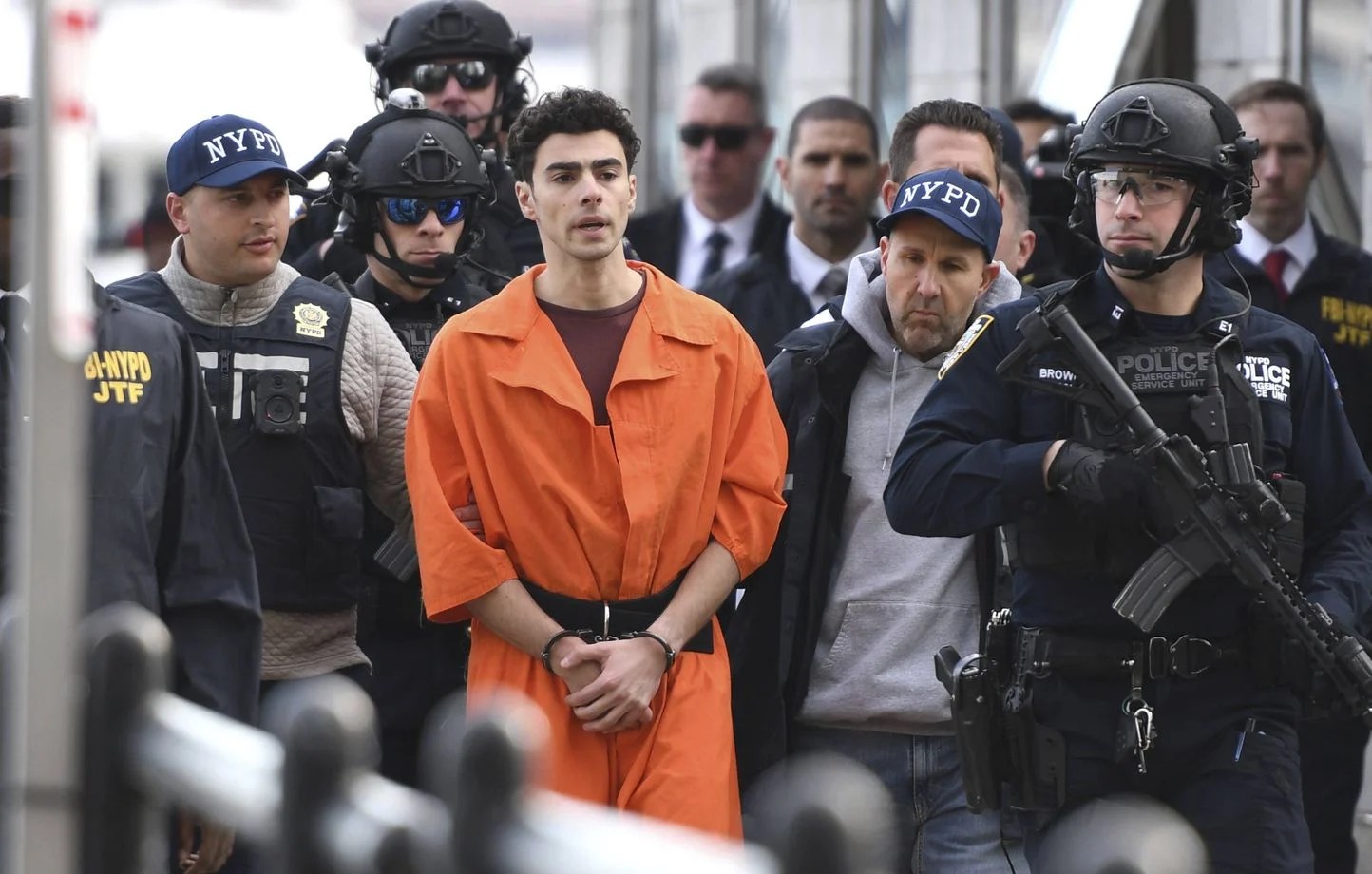 1444x920_luigi-mangione-a-suspect-in-the-fatal-shooting-of-united-healthcare-ceo-brian-thompson-is-escorted-by-police-thursday-dec-19-2024-in-new-york-ap-photo-pamela-smith-ny
